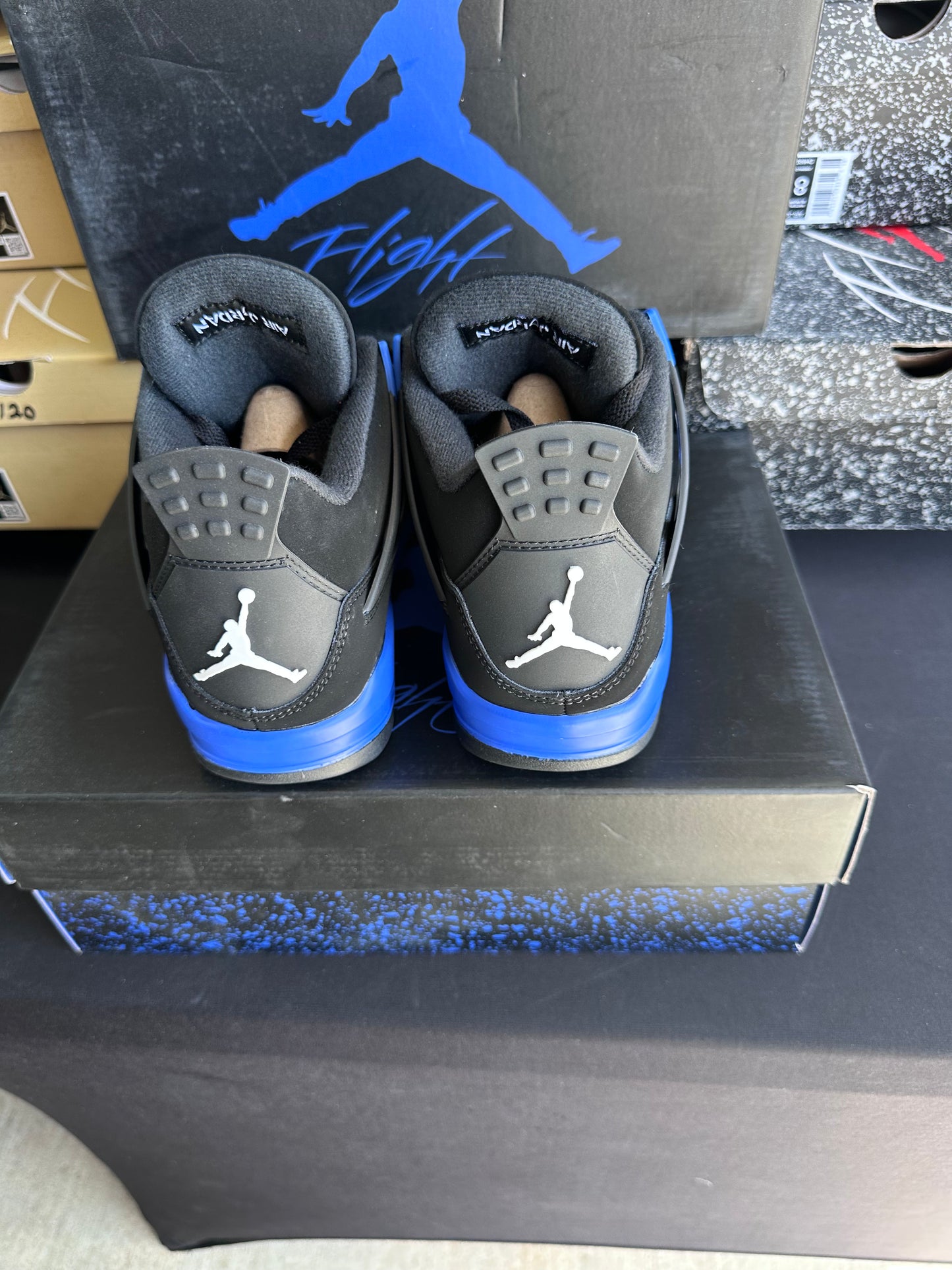 Back view of black and royal blue sneakers