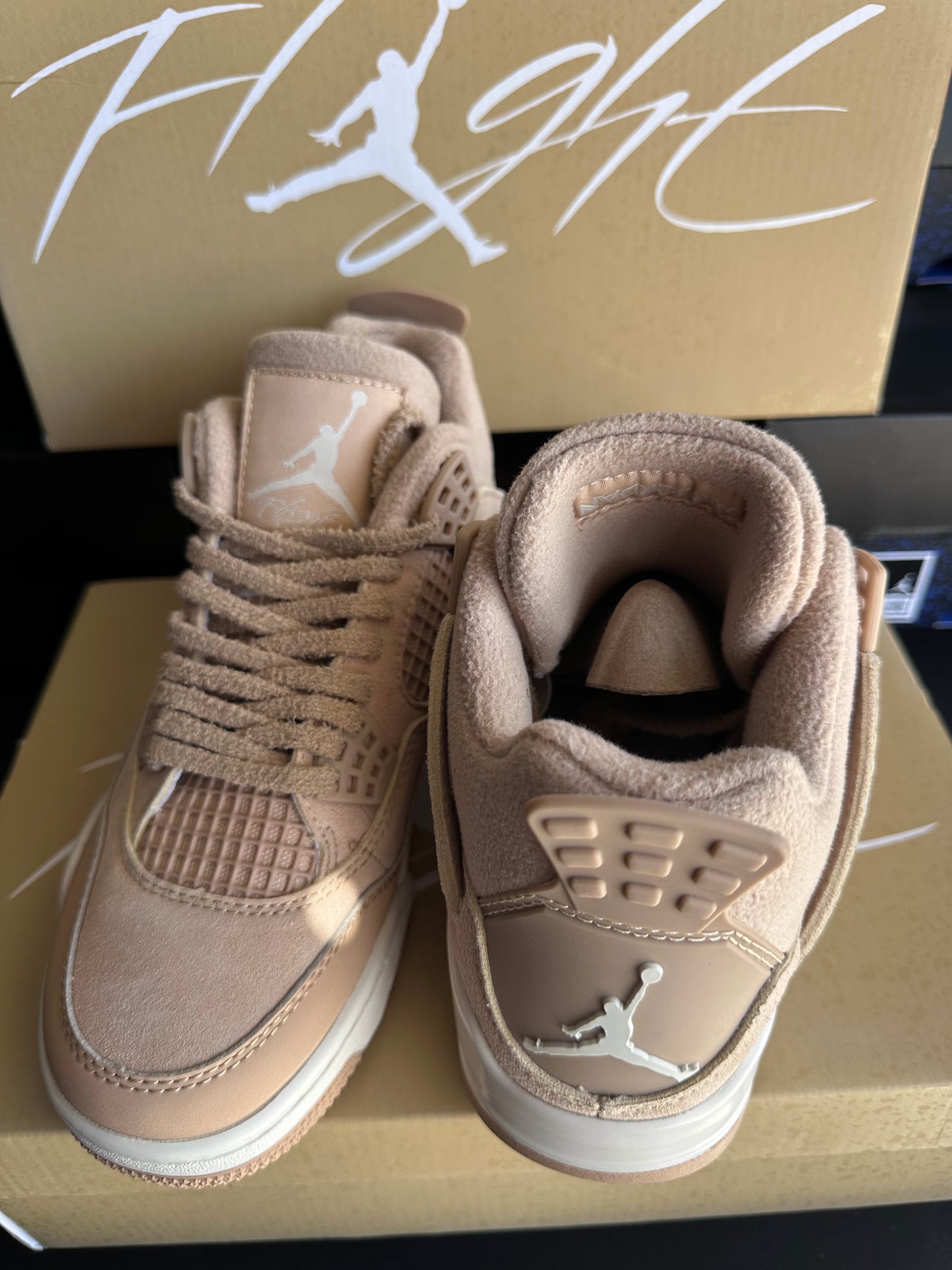 Front view of blush tan suede low top sneakers