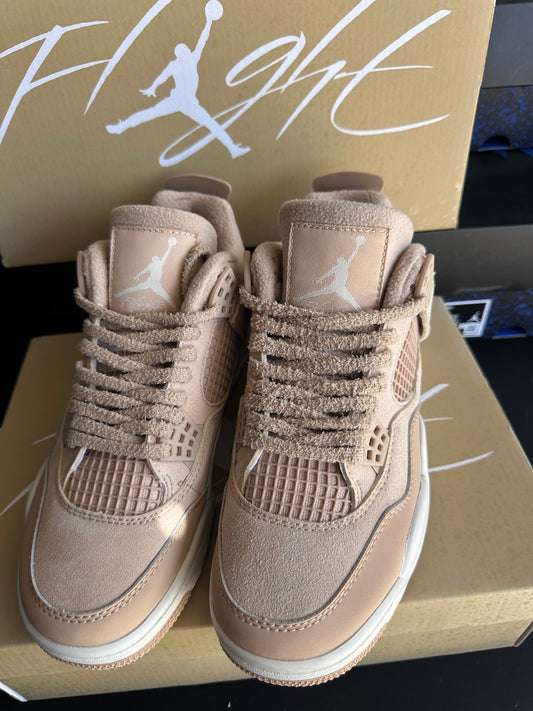 Neutral blush tan sneakers with textured laces