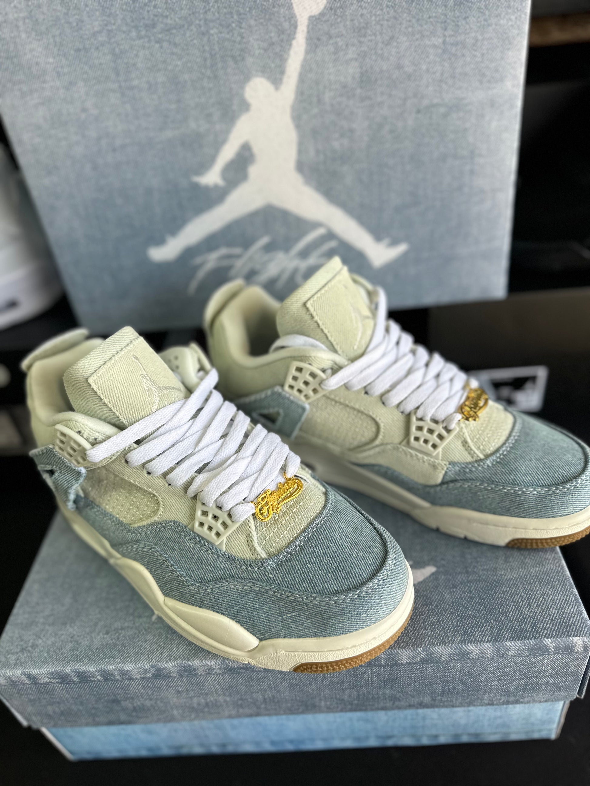 Front view of light blue and cream low top sneakers